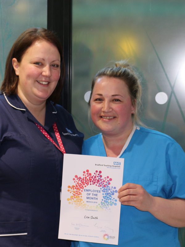 Intensive Care Unit staff nurse Lisa Smith (right) receives her award from Jenny Hughes, specialist nurse for organ donation