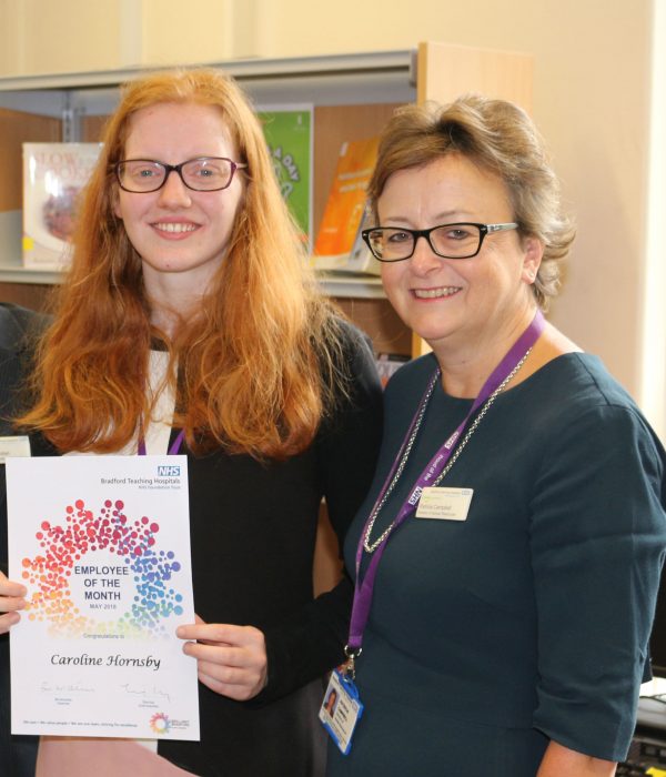 Caroline Hornsby receives her Employee of the Month award from Director of HR, Pat Campbell