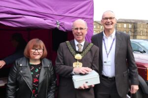 Chairman Max Mclean and his daughter Frances with Lord Mayor Councillor Martin Love who switched on the St Luke's Christmas tree lights