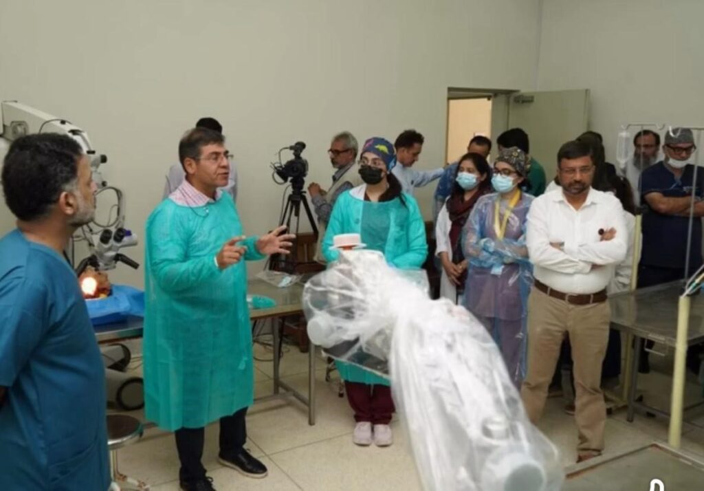 Prof Khan teaching in operating theatre