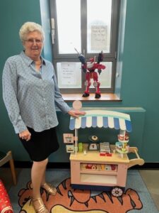 Pat with a toy donated by the young people of Bradford Academy who attend RotaKids every Thursday