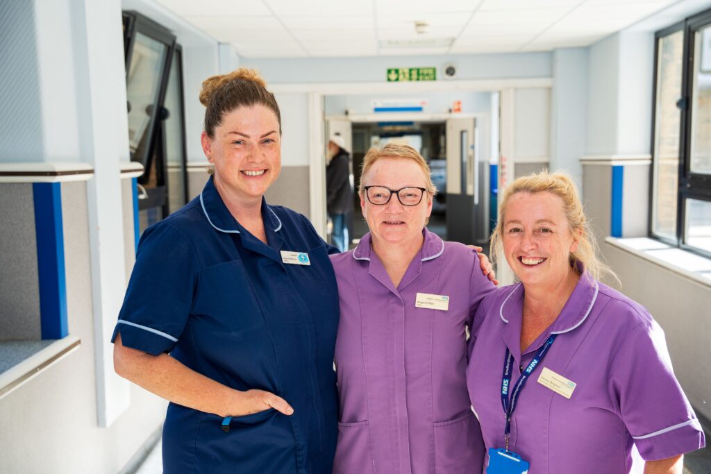 Colleagues Matron Karis Reeve and Senior Sister Tammy Bingham say goodbye to Angela (centre)