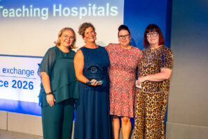 Team of the Year Award winners Katarzyna Babaczyk, Helen Naylor Shirley Horsfall receive their trophy from NBE's Jo Barker